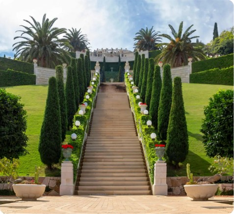 Grand landscaped garden staircase flanked by cypress trees